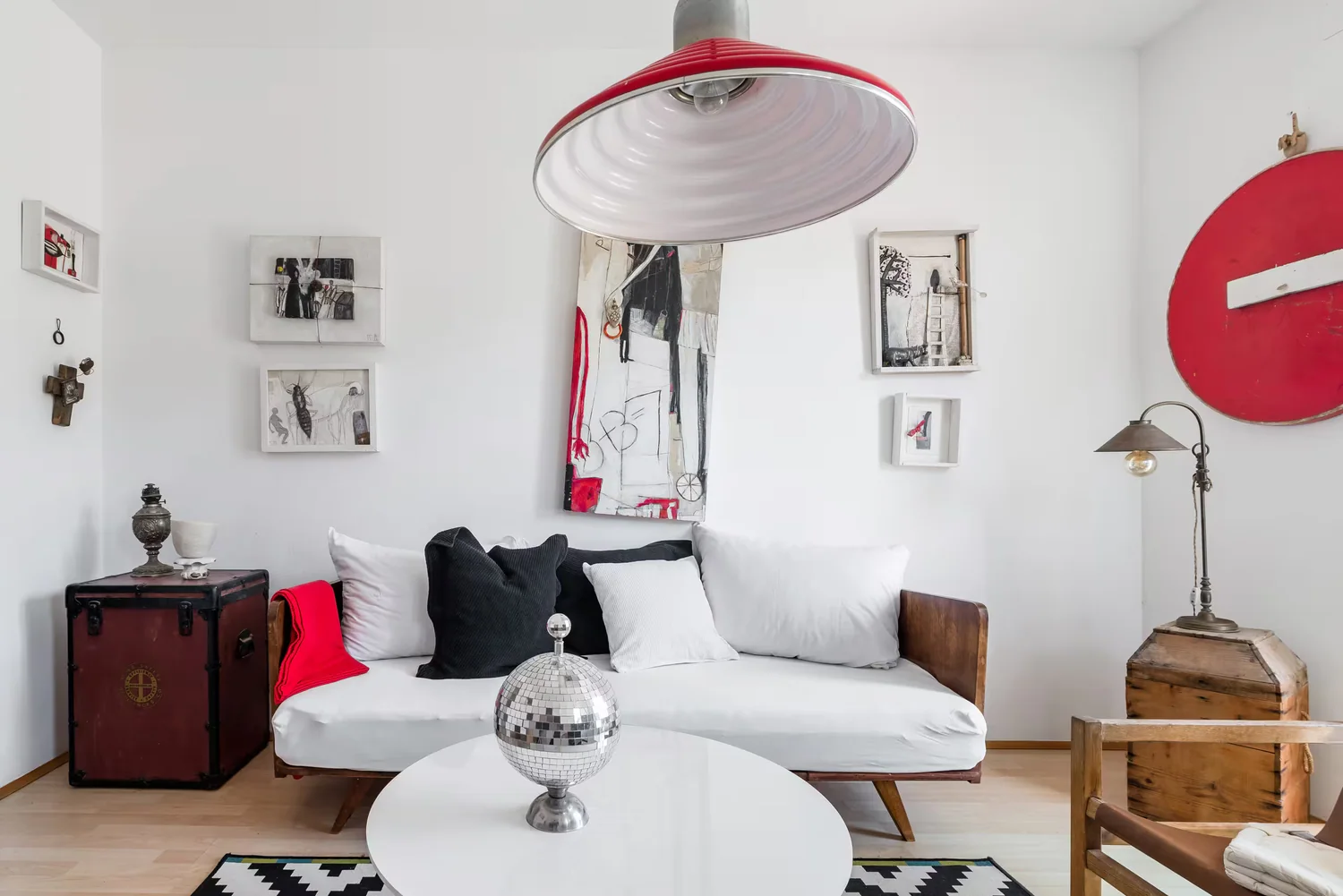 A large artwork installed in a living room setting.